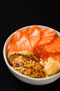 Salmon and Goose Liver Don It`s a Japanese style food. Raw, salmon fillet in orange, sliced, showing a distinctly white pattern o Royalty Free Stock Photo