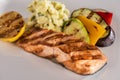 Salmon grill with healthy garnish