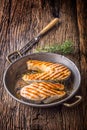 Salmon. Grilled fish salmon. Grilled salmon steak in roasted pan on rustic wooden table Royalty Free Stock Photo