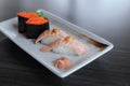 Salmon grilled nigiri sushi and Maki sushi with flying fish roe, Japanese food. Royalty Free Stock Photo