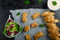 Salmon in herb batter with spicy dressing Royalty Free Stock Photo