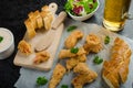 Salmon in herb batter with spicy dressing Royalty Free Stock Photo