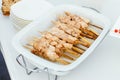 Salmon kebabs only fish on wooden skewers.