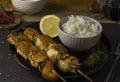 Salmon kebabs with a bowl of rice