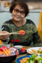 Salmon maki roll Japanese food restaurant, salmon sushi on plate. Sushi platter with a mixed variety of the Japanese delicacy at Royalty Free Stock Photo