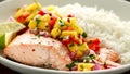 Salmon with mango salsa and white rice on plate