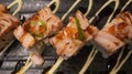 Salmon Oyako Spicy roll consist of crispy salmon skin is wrapped with sushi rice, topped with half broiled Aburi Salmon with spicy