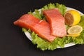 Salmon on a plate with salad and lemon Royalty Free Stock Photo