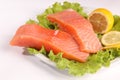 Salmon on a plate with salad and lemon Royalty Free Stock Photo