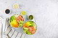 Salmon poke bowl with avocado, mango, micro green, vegetable and rice. Hawaiian food, pokebowl. Royalty Free Stock Photo