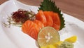 Salmon raw fillet fish sliced japanese sashimi alacarte foods menu on white dish Royalty Free Stock Photo