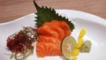 Salmon raw fillet fish sliced japanese sashimi alacarte foods menu on white dish Royalty Free Stock Photo