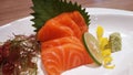 Salmon raw fillet fish sliced japanese sashimi alacarte foods menu on white plate Royalty Free Stock Photo