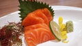 Salmon raw fillet fish sliced japanese sashimi alacarte foods menu on white plate Royalty Free Stock Photo