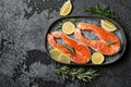 Salmon. Raw trout red fish steak with ingredients for cooking. Cooking Salmon, sea food. Healthy eating concept Royalty Free Stock Photo