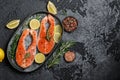 Salmon. Raw trout red fish steak with ingredients for cooking. Cooking Salmon, sea food. Healthy eating concept Royalty Free Stock Photo