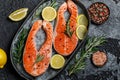 Salmon. Raw trout red fish steak with ingredients for cooking. Cooking Salmon, sea food. Healthy eating concept Royalty Free Stock Photo