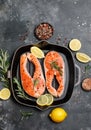 Salmon. Raw trout red fish steak with ingredients for cooking. Cooking Salmon, sea food. Healthy eating concept Royalty Free Stock Photo