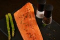 Salmon. Raw Trout Red Fish Steak served with Herbs and Lemon and olive oil on slate. Cooking Salmon, sea food. Healthy eating Royalty Free Stock Photo