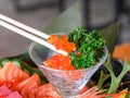 Salmon roe, Salmon caviar or ikura in a cocktail glass garnished with leaves Royalty Free Stock Photo