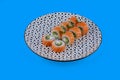 salmon rolls on blue background for online restaurant menu