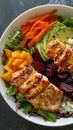 Salmon salad bowl with avocado, carrots, beets, and mango