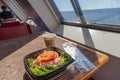 Salmon sandwich, coffee in disposable bowl breakfast travel concept