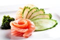 Salmon sashimi with cucumber on a white background Royalty Free Stock Photo