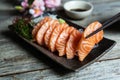 Salmon sashimi Japanese food with soy sauce on table Royalty Free Stock Photo