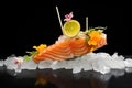 salmon sashimi over ice with lemon slices