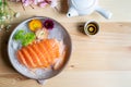 Salmon sashimi slice fresh serve on ice with tea Royalty Free Stock Photo