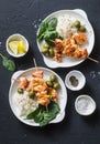 Salmon skewers, olives, spinach, rice - healthy lunch table. Grilled salmon fish skewer and side dish on a dark background Royalty Free Stock Photo