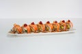 Salmon smoked filled avocado, kani, tamago, cucumber pickle sushi roll with cream cheese