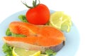 Salmon steak on blue dish Royalty Free Stock Photo