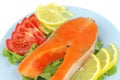 Salmon steak on blue dish Royalty Free Stock Photo