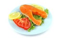 Salmon steak on blue dish Royalty Free Stock Photo