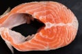 salmon steak close-up view from above on a black board Royalty Free Stock Photo