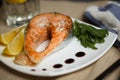 Salmon steak with fresh salad and lemon slices Royalty Free Stock Photo