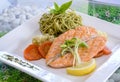 Salmon steak grill served with pesto pasta