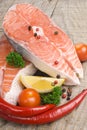 Salmon steak with lemon, pepper and parsley Royalty Free Stock Photo