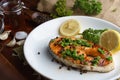 Salmon steak served on white plate