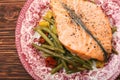 Salmon steak, veggies and herbs