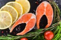 Salmon steakes with greenery, lemon and cherry tomatoes