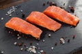 salmon steakes with pepper and salt grains