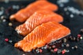 Salmon steakes with pepper and salt grains