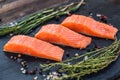 Salmon steakes with thyme, rosemary, pepper and salt