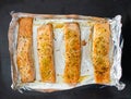 Salmon steaks oven roasted on a foil close up