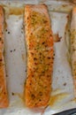 Salmon steaks oven roasted on a foil close up