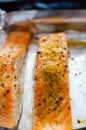 Salmon steaks oven roasted on a foil close up