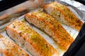 Salmon steaks oven roasted on a foil close up